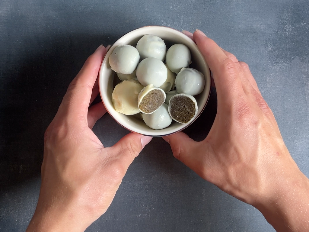 Chocolatey and Chewable Matcha Energy Balls and hands